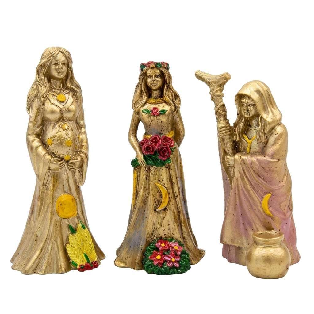 Three decorative figurines representing women in flowing dresses, adorned with floral details and symbolic elements. Each figure has a unique pose and design, showcasing a blend of elegance and mysticism.