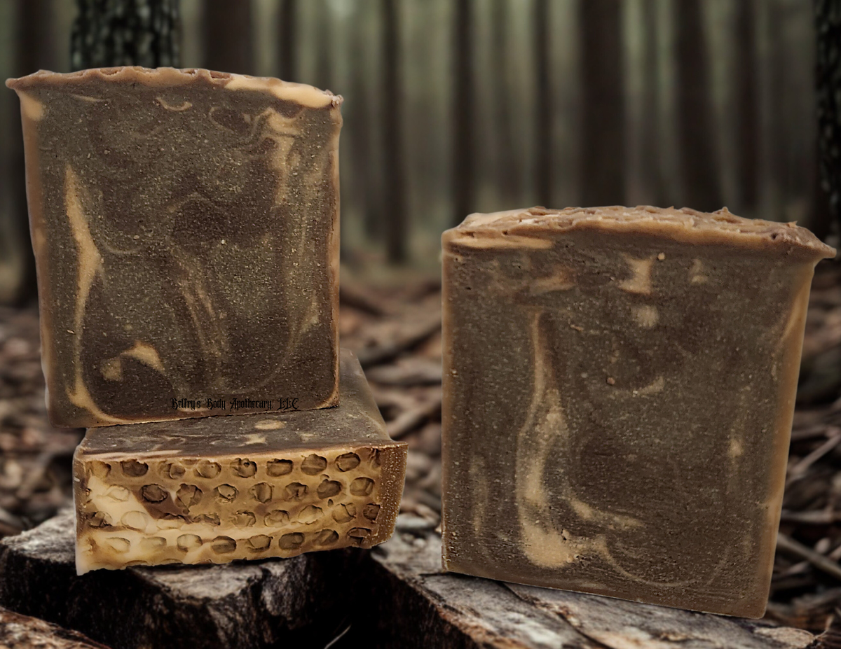 Grounding collection - three honey and goat milk soap bars with honeycomb texture on top.