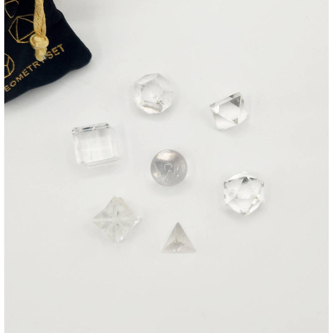 Clear Quartz Sacred Geometry Set – 7 Carved Crystals + Merkaba &amp; Sphere with Grid &amp; Pouch