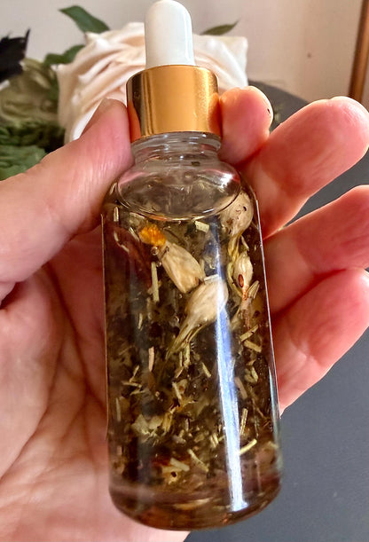 Abundance Ritual Anointing Oil with Essential Oils and Herbs.