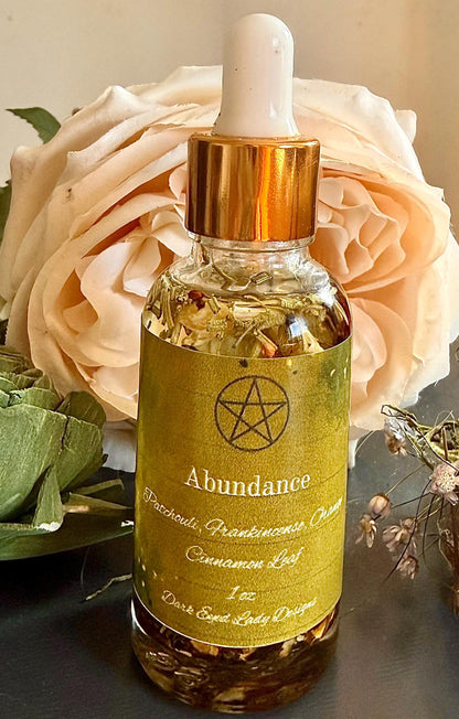 Abundance Ritual Anointing Oil with Essential Oils and Herbs.