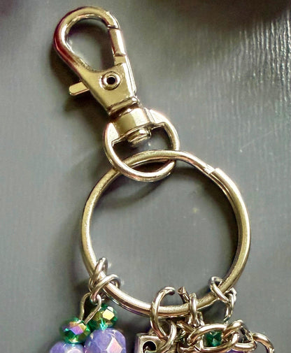 Witch Engraved Key Chain Bag Charm with Iridescent Glass Beads and Witchy Charms.