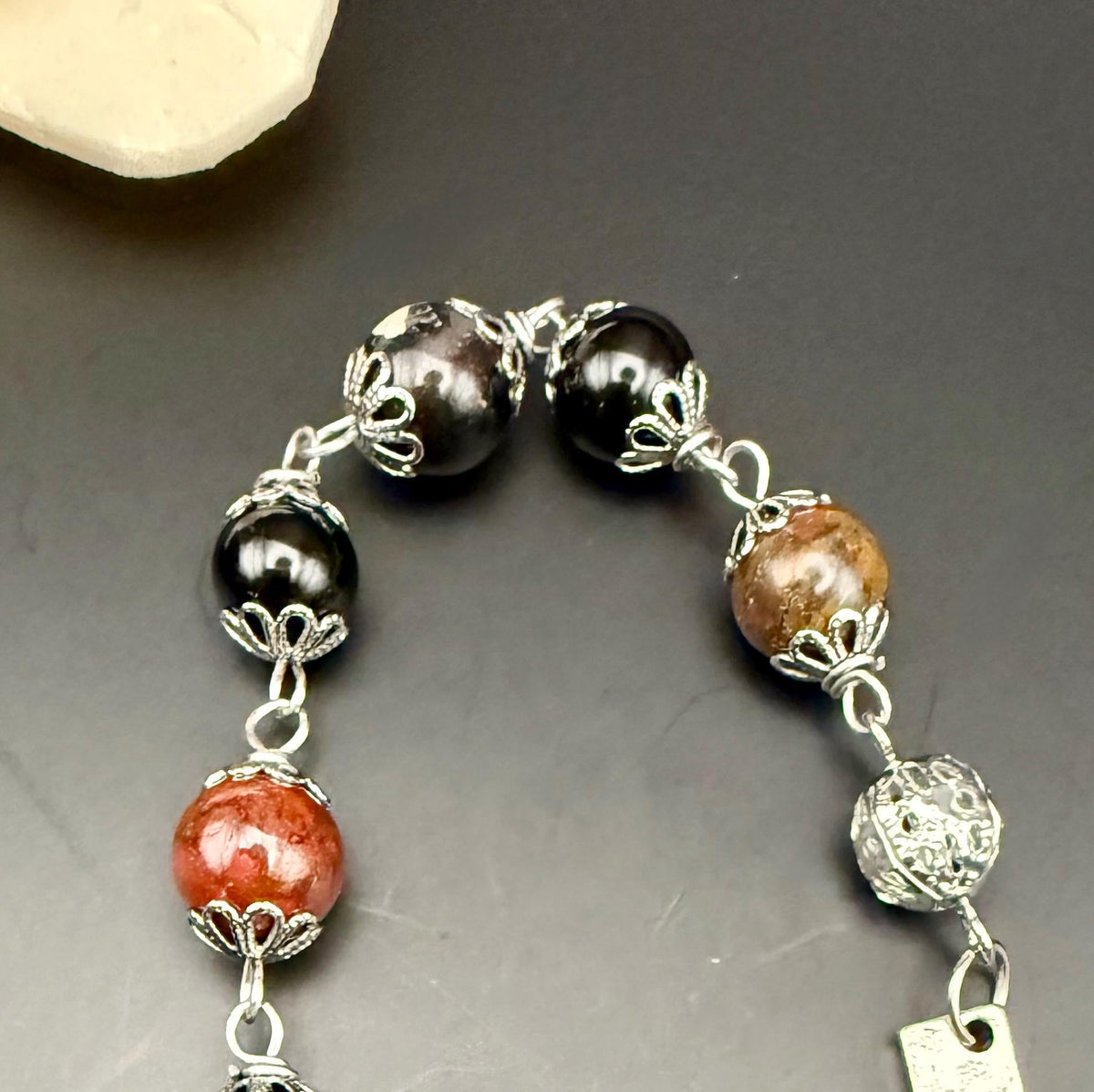 Samhain Pendulum with Tourmaline Point,  Red Brecciated Jasper, Obsidian, and Witch’s Knot Charm.
