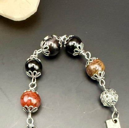 Samhain Pendulum with Tourmaline Point,  Red Brecciated Jasper, Obsidian, and Witch’s Knot Charm.