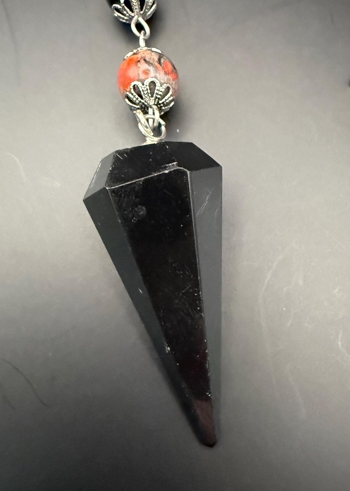 Samhain Pendulum with Tourmaline Point,  Red Brecciated Jasper, Obsidian, and Witch’s Knot Charm.