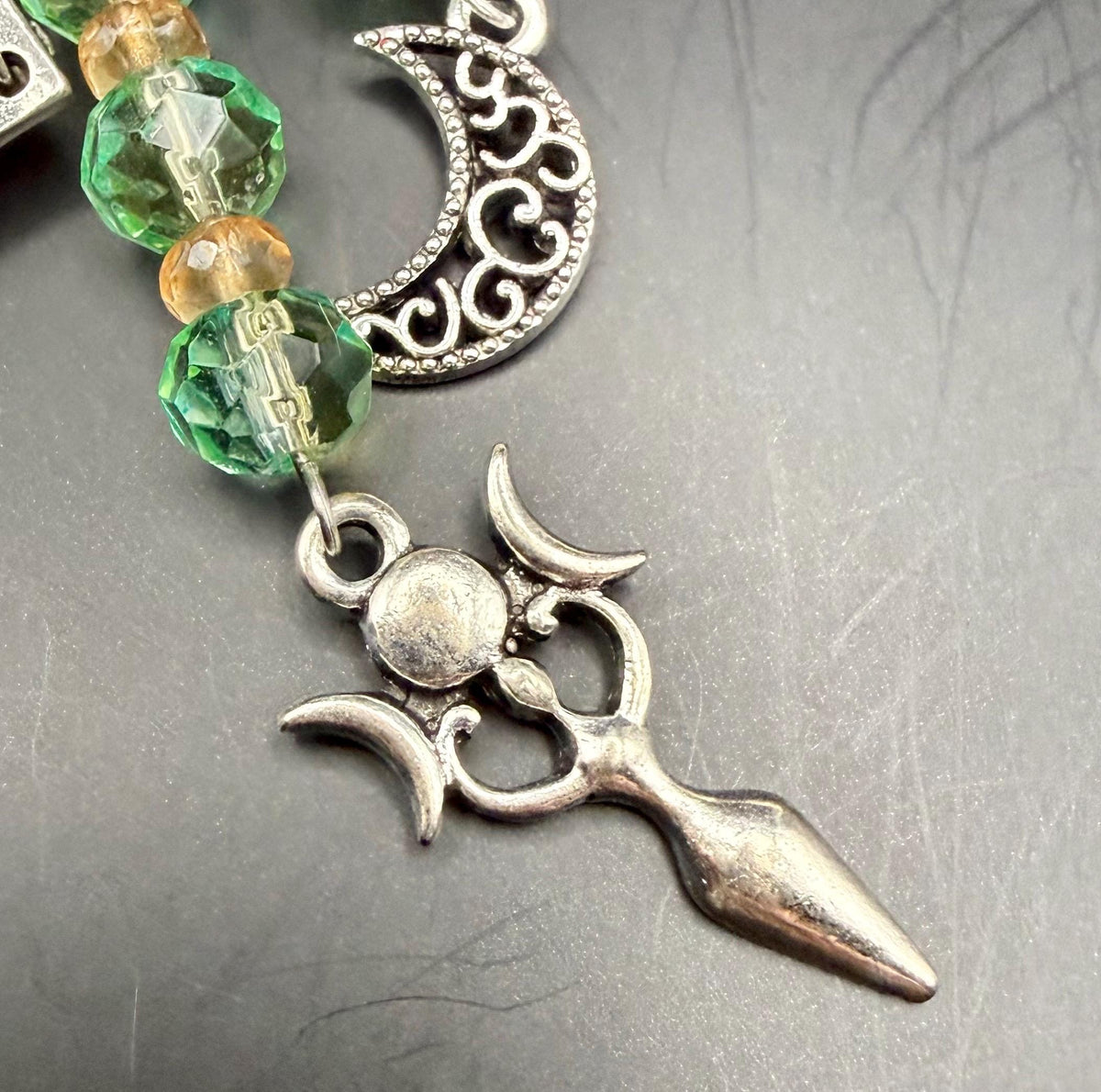 Witch Engraved Key Chain Bag Charm with Iridescent Glass Beads and Witchy Charms.