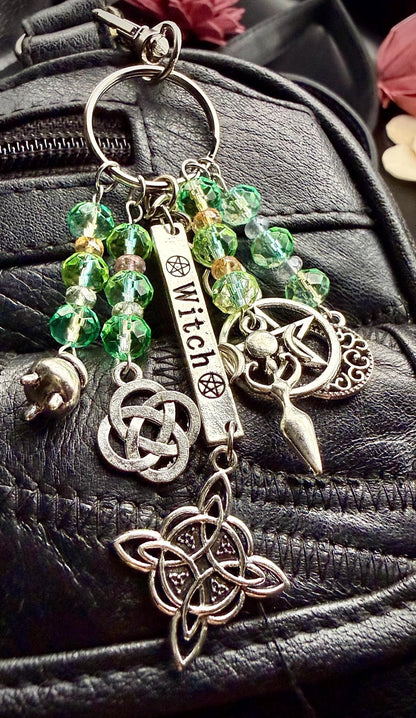 Witch Engraved Key Chain Bag Charm with Iridescent Glass Beads and Witchy Charms.