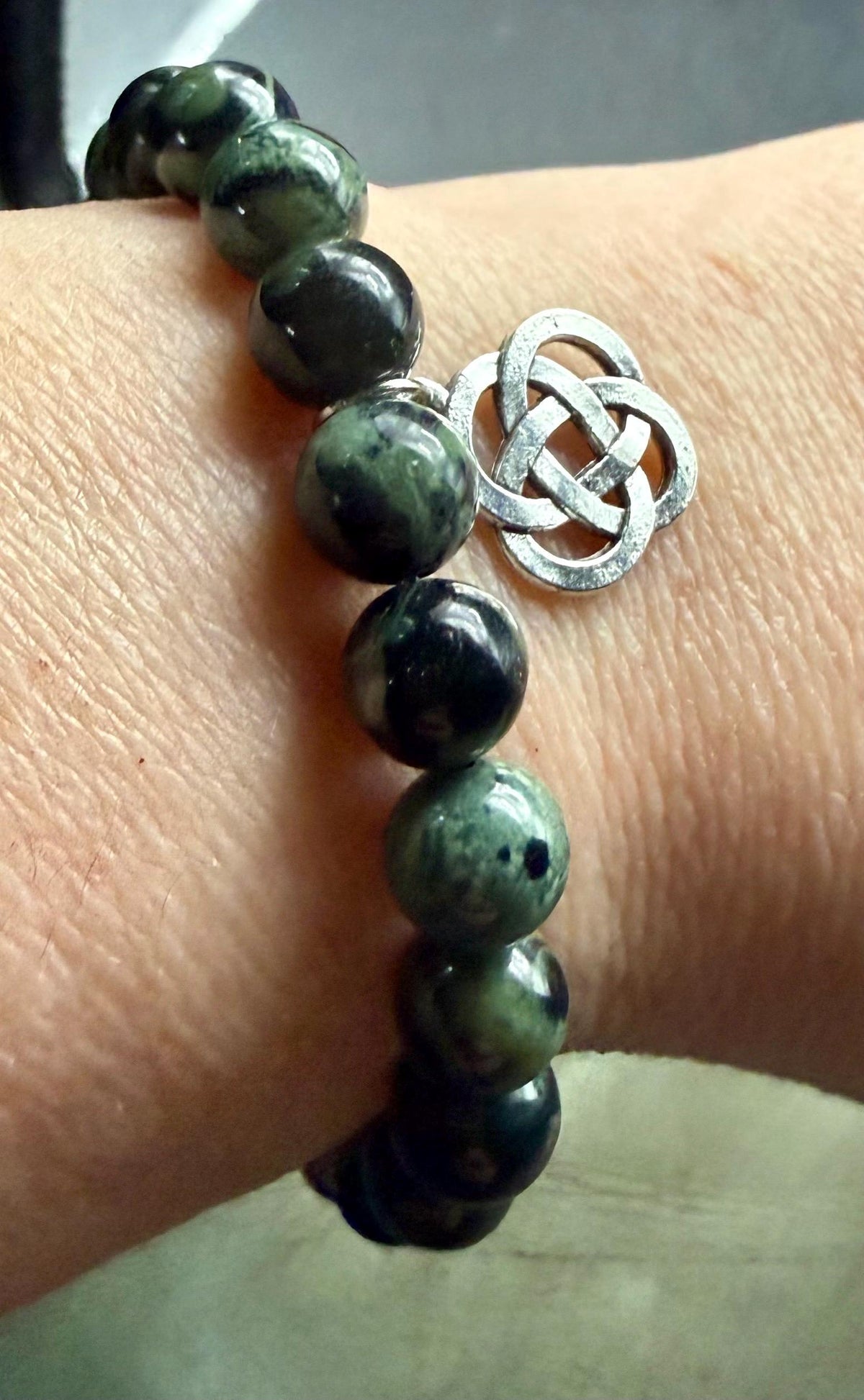 Kambaba Jasper Gemstone Stretch Bracelet with Celtic Knot Charm.