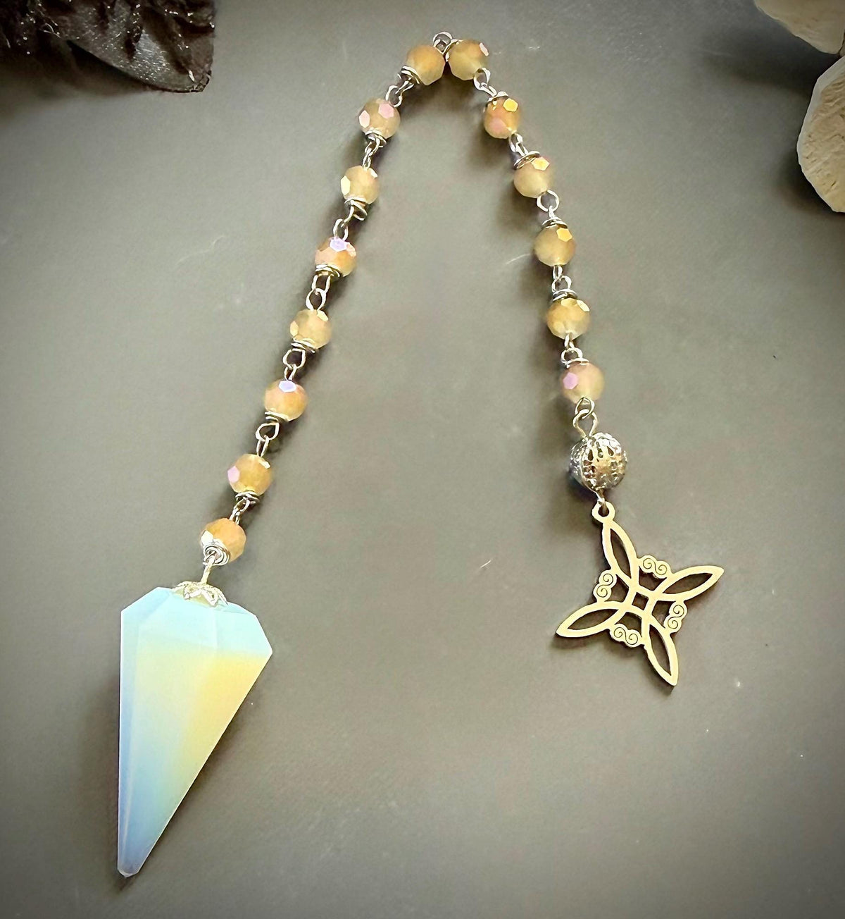 Opalite Handmade Pendulum with Crystal Glass Beads and Witch’s Knot Charm.