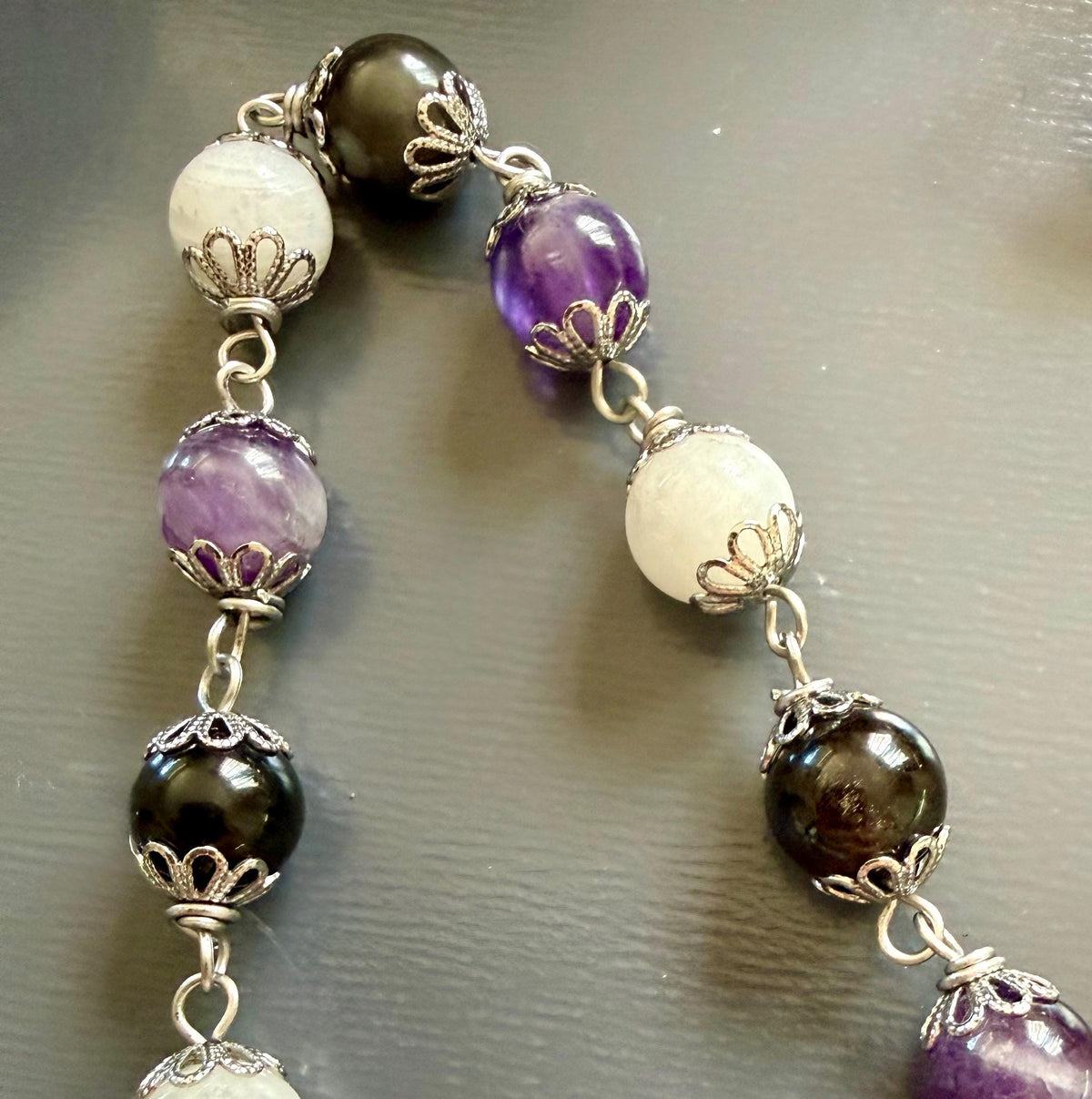 Wheel of Hekate Strophalos Devotional Prayer Beads:  Amethyst, Obsidian, and Moonstone.