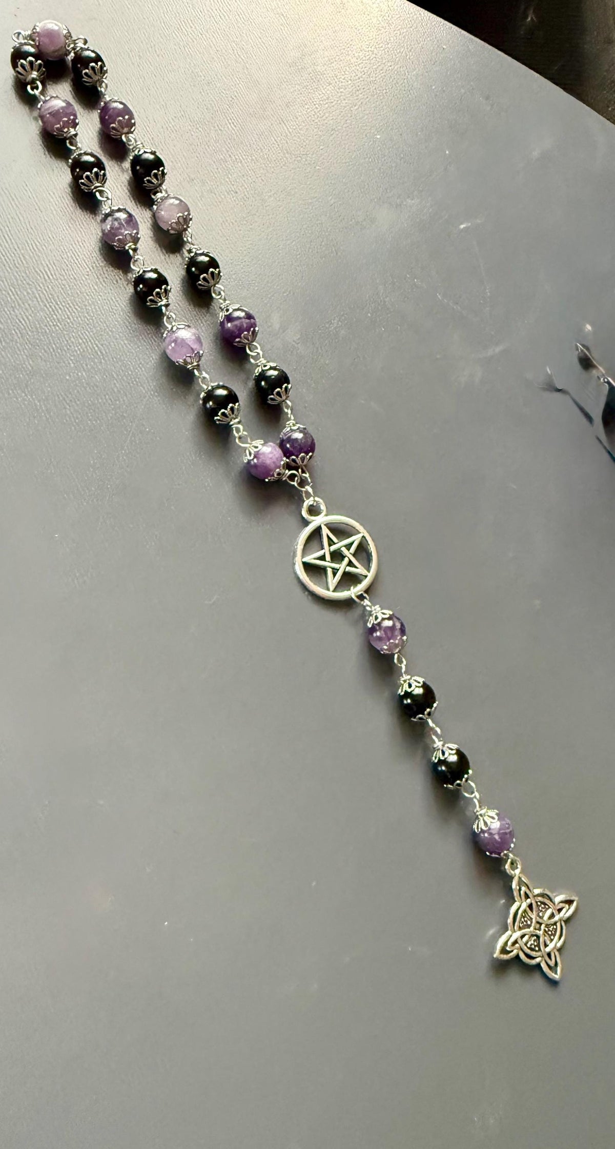 Witch’s Knot Rosary with Amethyst and Tourmaline Gemstones.