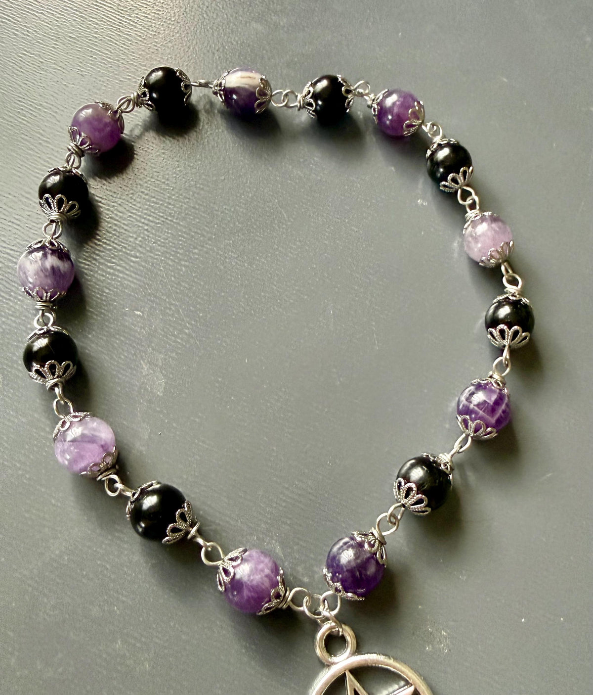 Witch’s Knot Rosary with Amethyst and Tourmaline Gemstones.