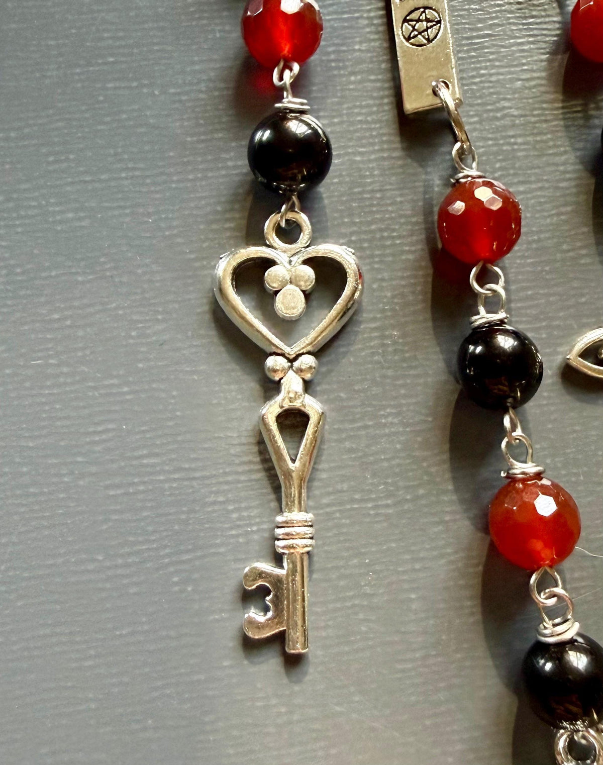 Witchy Car Charm Accessory:  Carnelian, Black Tourmaline Beads with Crow Skull, Witch’s Knot, and Key Charms.