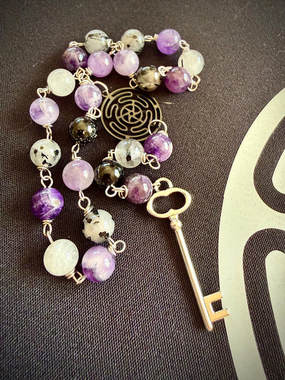 Goddess Hekate Devotional Altar Bundle with Altar Cloth, Witch’s Rosary, Pendulum , Black, and Purple Taper Candles.