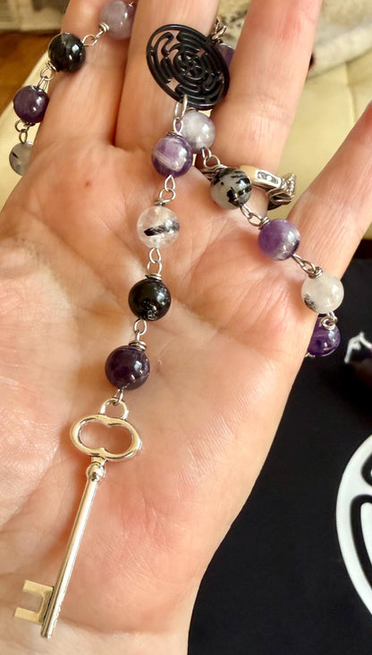 Goddess Hekate Devotional Altar Bundle with Altar Cloth, Witch’s Rosary, Pendulum , Black, and Purple Taper Candles.