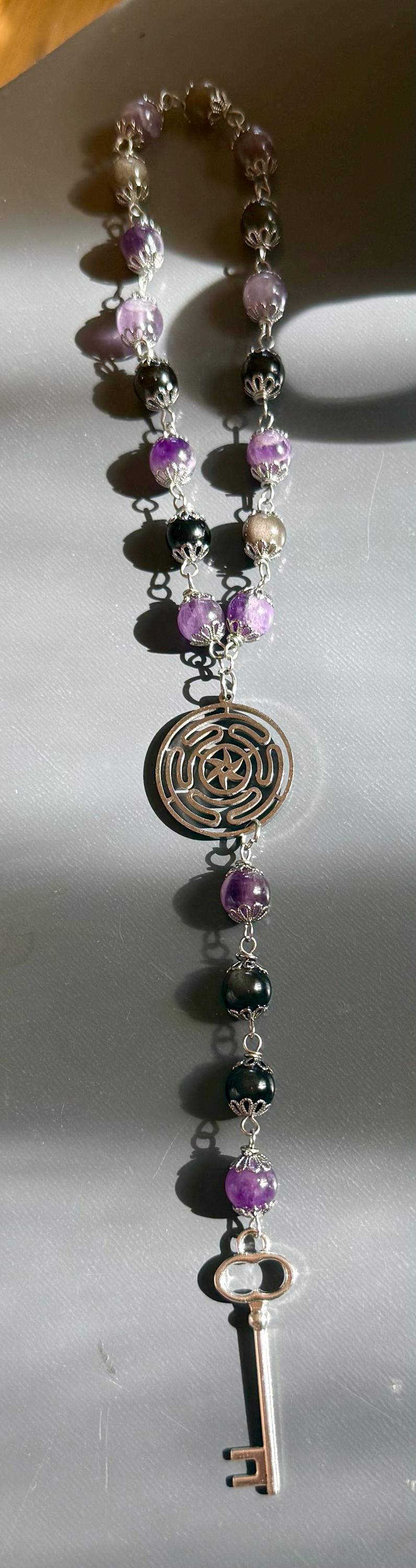 Hekate’s Wheel Strophalos Witches Rosary: Amethyst, Obsidian , and Key Charm.