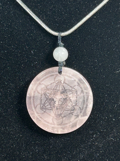 Beautifule Rose Quartz Pendant with the Flower of Life Carved in w/ a Sliver Plated Necklace.