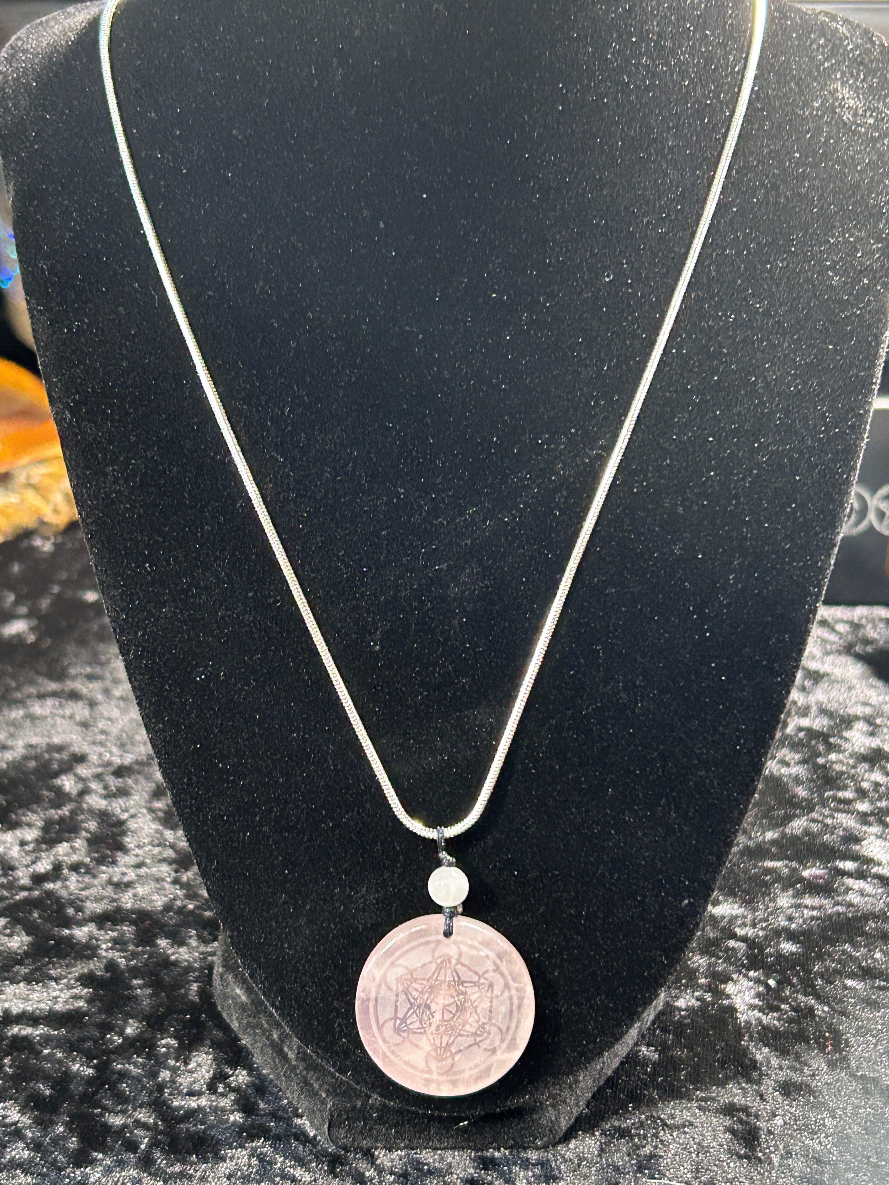 Beautifule Rose Quartz Pendant with the Flower of Life Carved in w/ a Sliver Plated Necklace.