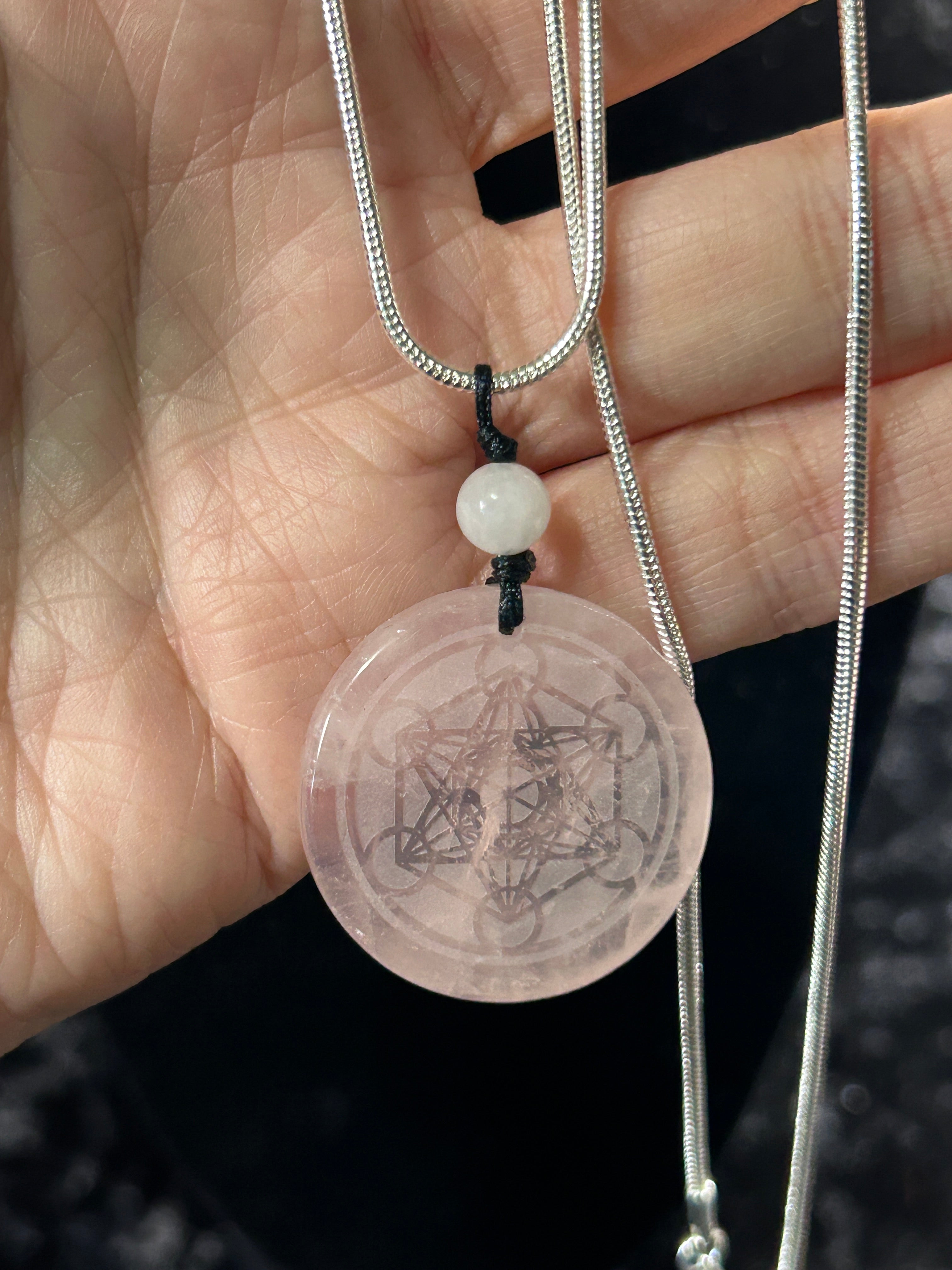 Beautifule Rose Quartz Pendant with the Flower of Life Carved in w/ a Sliver Plated Necklace.