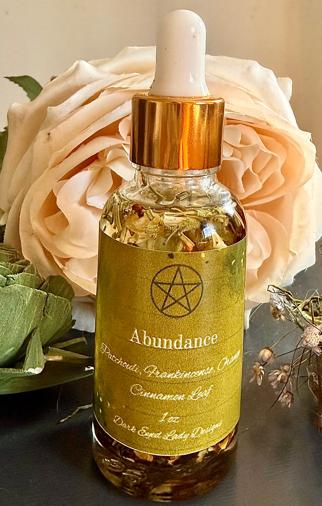 Abundance Ritual Anointing Oil with Essential Oils and Herbs.