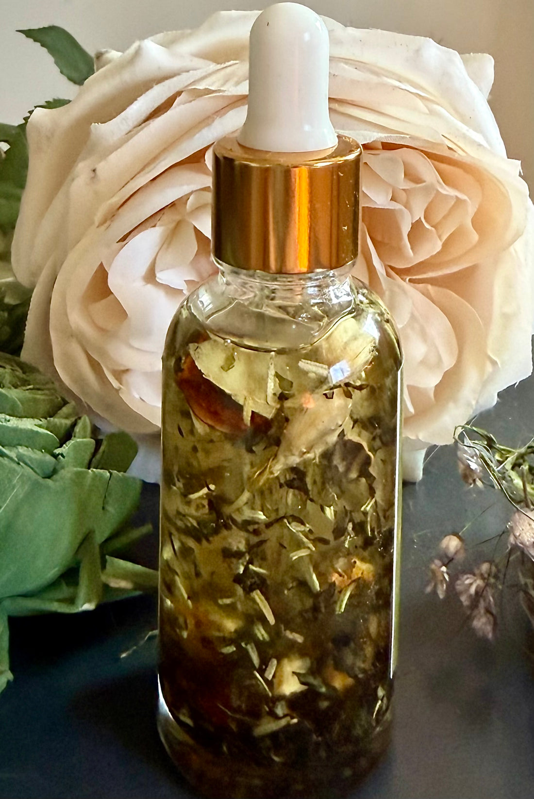 Abundance Ritual Anointing Oil with Essential Oils and Herbs.