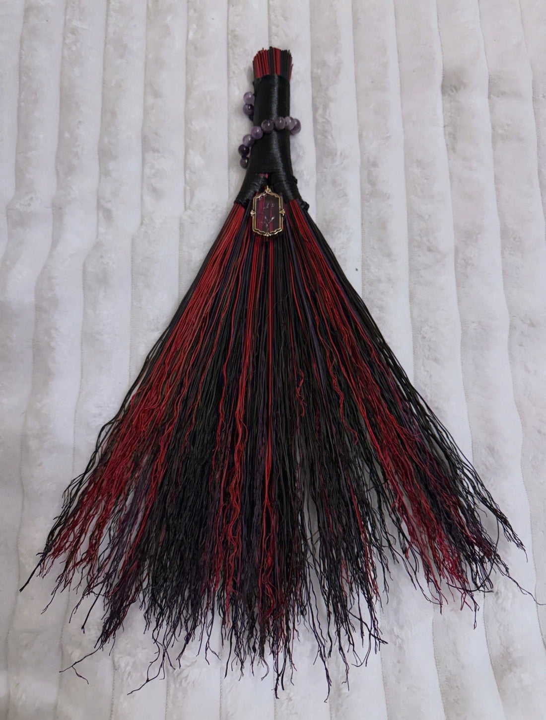 Carved charm broom