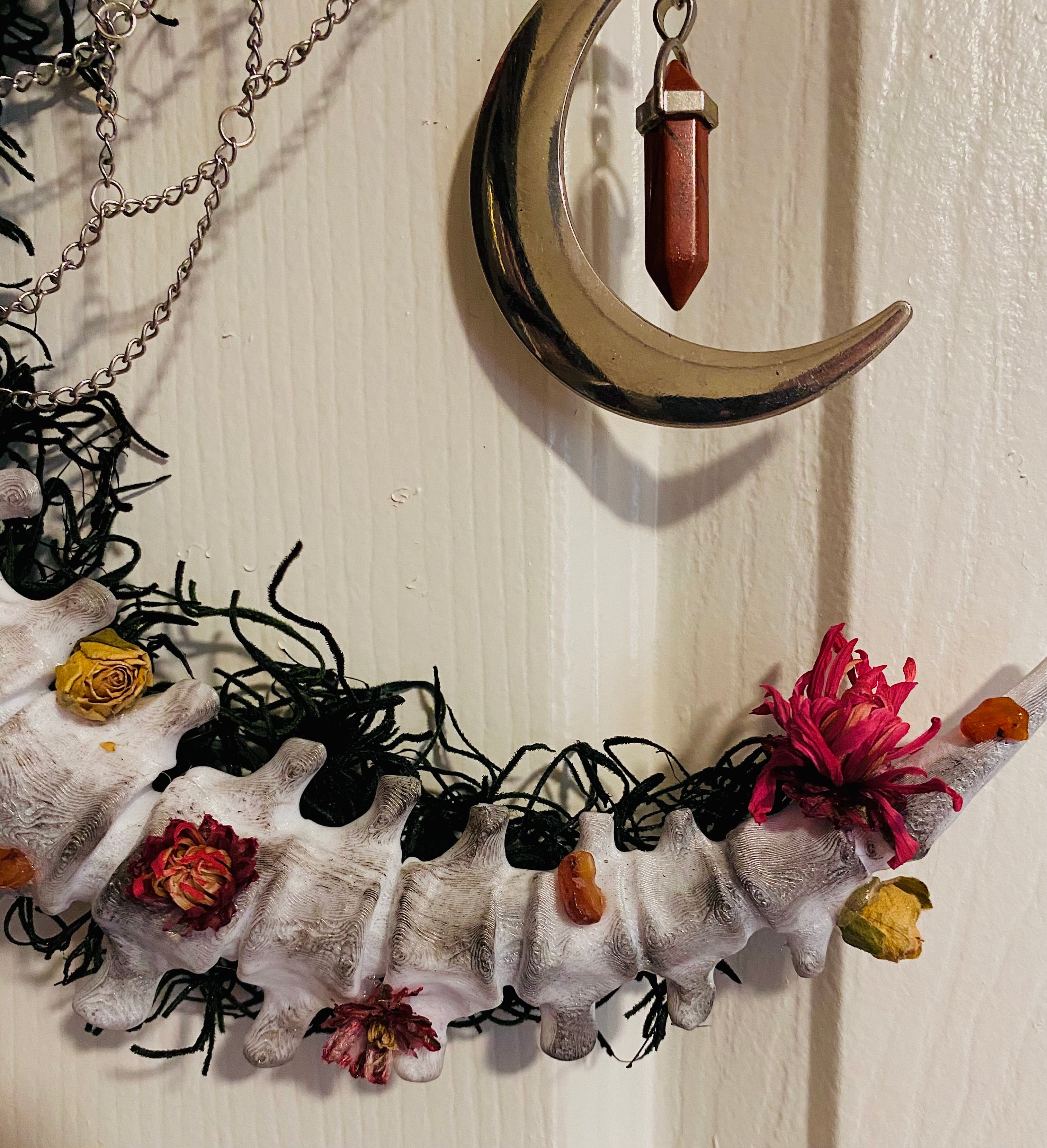 Floral crescent spine wreath