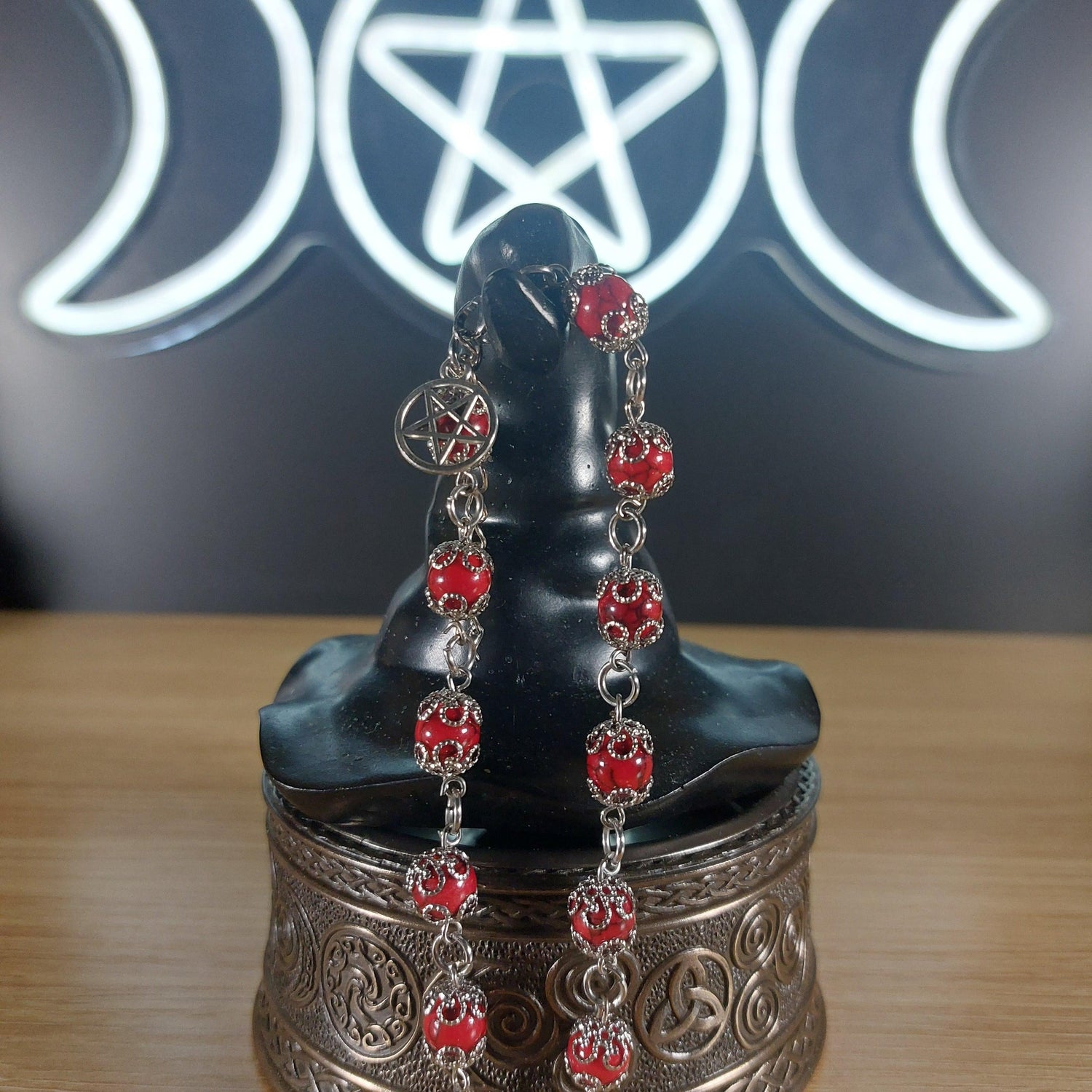 Dyed red quartz crystal bracelet with stainless steel findings, bead caps, and a pentagram charm.