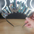 Metallic rainbow quartz crystal crown headband with a silver crescent moon accent.