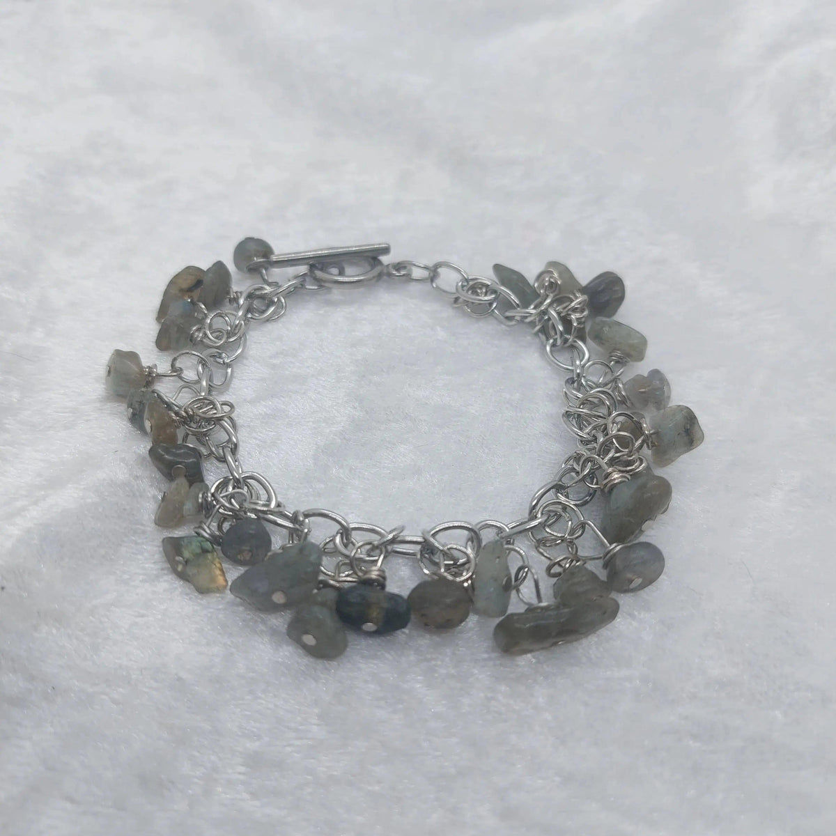 Labradorite chip bracelet with iridescent gray stones on a silver chain and toggle clasp.