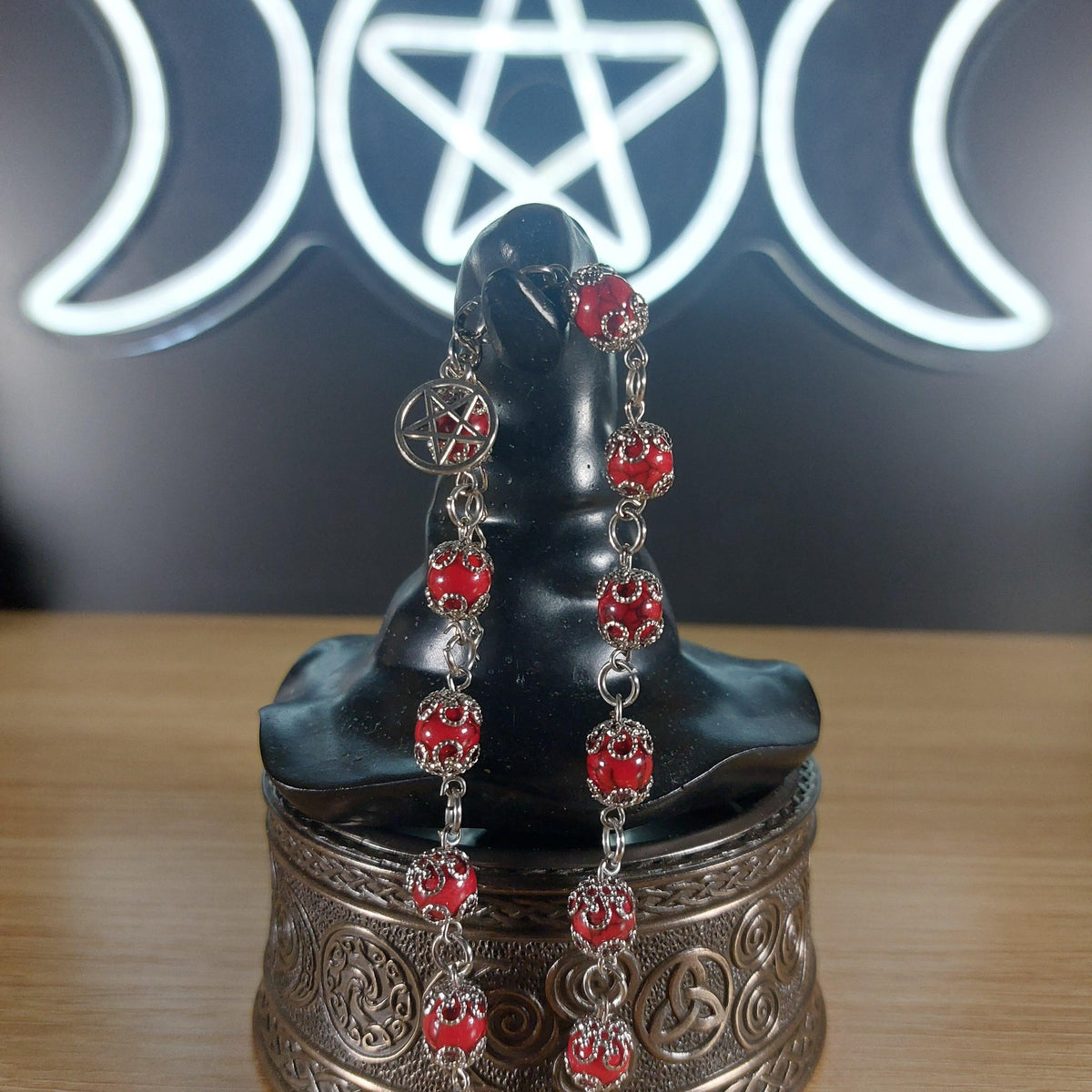 Dyed red quartz crystal bracelet with stainless steel findings, bead caps, and a pentagram charm.