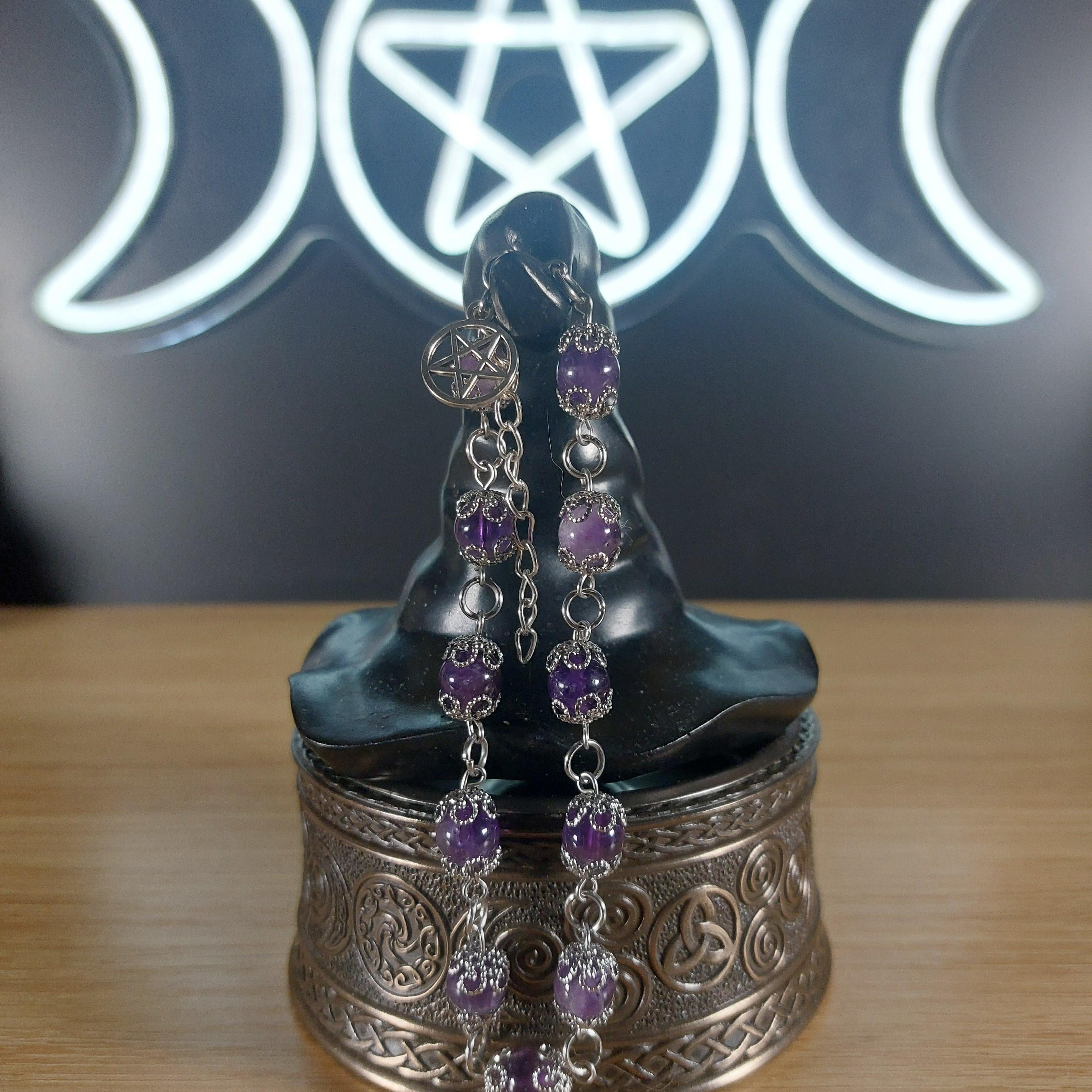 Amethyst crystal beaded bracelet with stainless steel findings, bead caps, and a pentagram charm.
