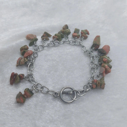 Unakite chip bracelet with green and pink stones on a stainless steel chain.