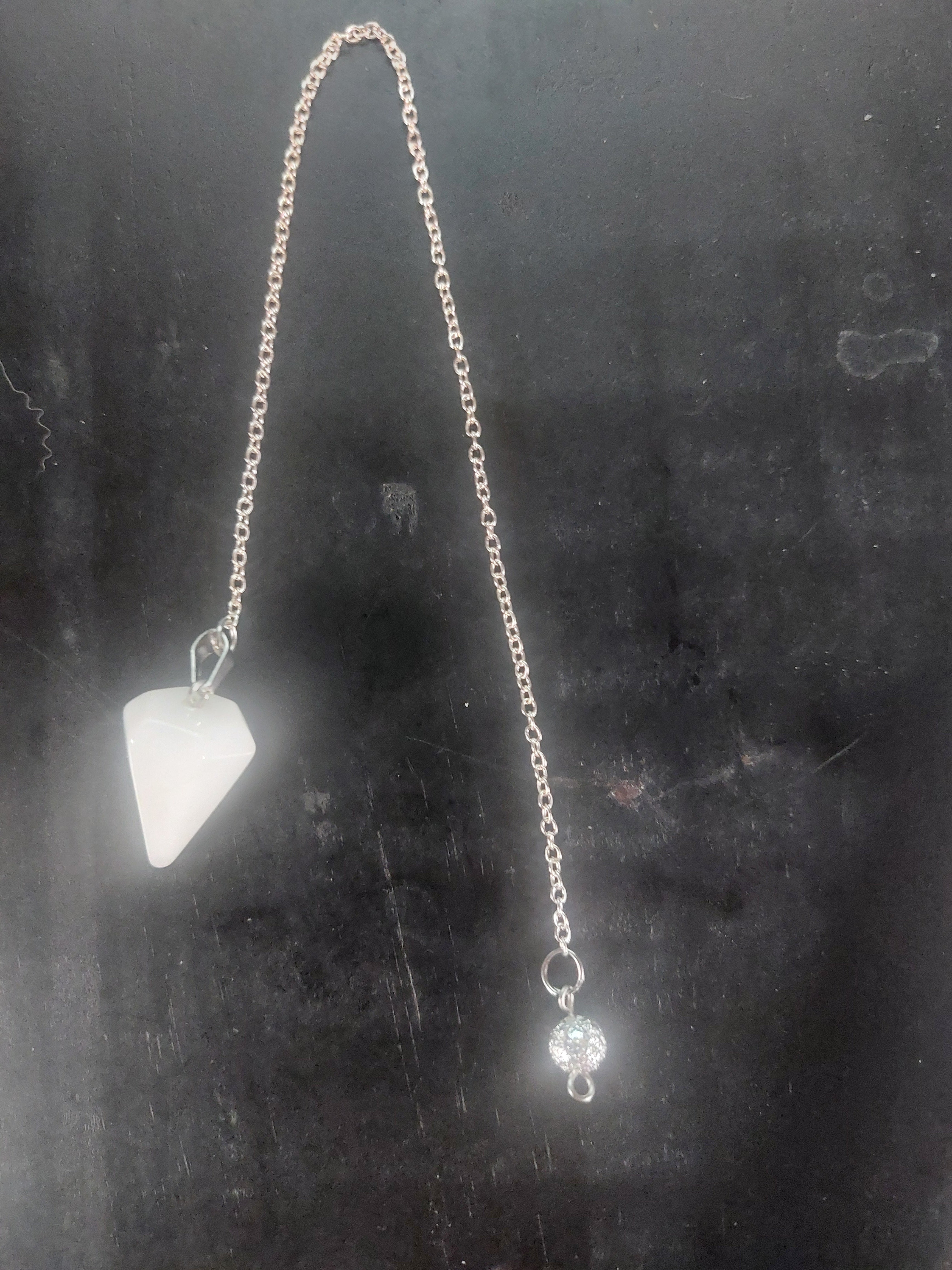 Clear Quartz Pendulum on a Silver Tone Cain