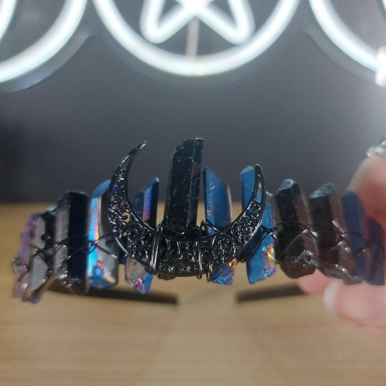 Black and blue treated quartz crystal crown headband with crescent moon accents, wrapped in dark wire.
